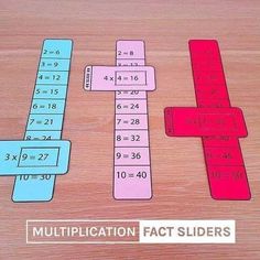 three different colored puzzles on a table with the words multiplication fact sliders