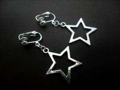 This a pair of pretty little tibetan silver dangly star clip on earrings. Measure approx. 3cm from top of hook to bottom of earring. These earrings are not for pierced ears. Freshly made by me and unworn. Thanks for looking!! Y2k Glasses, Metal Stars, Pretty Hands, Silver Stars, Star Earrings, Pierced Ears, Clip On, Ear Piercings, Clip On Earrings