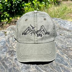 "Explore the outdoors! Take a fresh breath of air as you go on a hiking adventure into the mountains, and witness amazing scenery this summer wearing a comfortable and adjustable cap.  - CUSTOM TEXT available on the back of cap, above strap opening - Back and front embroidery will be with the SAME thread color that was chosen unless noted otherwise; default: white / black thread depending on the cap color - Your wording will be embroidered according to what dimensions we believe look best on the Mens Embroidered Hat, Heavenly Clothes, Camp Hair, Walking Outdoors, Adventure Hat, Mountain Hat, Womens Gifts, Wash Baseball Cap, Christian Hats