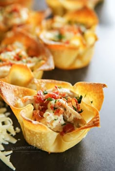 small cups filled with food sitting on top of a table