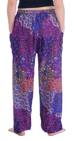 These cute peacock printed drawstring pants are handmade with rayon fabric which make them super comfy to wear. They have an comfortable elastic waist and ankles. Also drawstring with pants colors. The two pockets are good size enough to fit an iPhone 7. These trousers are are perfect for relaxing at home, working out, yoga running, beachwear and general casual wear. Also recommended for Thai massage, dance and festivals. Lannaclothesdesign products are uniquely designed and latest fashion trend Multicolor Elastic Waistband Harem Pants For Loungewear, Multicolor Harem Pants With Elastic Waistband For Loungewear, Multicolor Printed Pants For Festival, Purple Cotton Harem Pants With Elastic Waistband, Purple Bohemian Pants For Festival, Bohemian Printed Pants For Loungewear, Bohemian Purple Pants For Festival, Bohemian Printed Loungewear Pants, Bohemian Purple Festival Pants