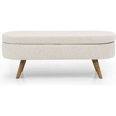 an upholstered bench with wooden legs