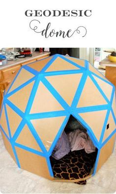 the inside of a cardboard dome that is made to look like a giraffe