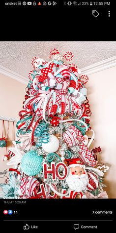 a christmas tree decorated with red, white and blue ribbons