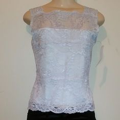 Brand New With Tags. Light Blue Lace Stretch Top. This Top Is Beautiful. Very Soft And Luxurious. High End Brand Name. This Top Will Go Perfectly Under A Blazer Or Cardigan. Or Dress Down With A Pair Of Jeans. It Also Has Extra Material In The Front To Cover So That You Can Be Bra-Less. Great Top And Way Underpriced To Sell. Open To All Reasonable Offers. Fitted Sleeveless Lace Tank Top, Blue Fitted Lace Camisole, Lace V-neck Camisole With Contrast Lace, Blue Lace Trim Camisole, Chic Blue V-neck Camisole, Luxury Lace Top V-neck Camisole, Stretch Lace Top, High End Brands, Lace Sleeveless Top