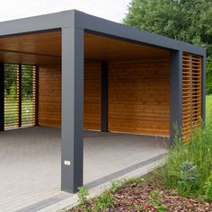 an outdoor covered area with wooden slats