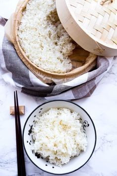 rice in a bowl with chopsticks next to it