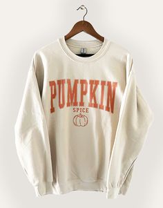 The perfect sweatshirt for lovers of fall! Warm your heart and embrace the fall season with our "Pumpkin Spice" Graphic Sweatshirt. This delightful and cozy sweatshirt is designed to capture the essence of autumn, making it the perfect addition to your seasonal wardrobe.PRODUCT SPECIFICATIONS*Screen printed ‘Pumpkin Spice’ on Crewneck Sweatshirt*Unisex Sizing*Online Only Preppy Fall Sweatshirts, Cute Fall Crewnecks, Halloween Sweater Ideas, Cricut Fall Sweatshirt Ideas, Cute Fall Sweatshirts, Sweatshirts Cricut, Fall Sweatshirt Ideas, Cute Fall Sweaters, Fall Sleepover