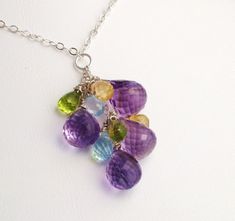 Artisan Amethyst Peridot Citrine Topaz Gems Necklace.  Natural Gemstones.  Wire wrapped jewelry.  Cluster of beautiful, faceted, untreated gemstones: purple Amethyst, green Peridot, blue Topaz and yellow Citrine stones.   This beautiful necklace will be a great gift for her. Modern, lightweight, neutral.  Each gemstone is hand wire wrapped to sterling silver and attached to sterling silver chain which is standard 18 inches long ( can be adjusted when you buy it from 14 to 20 inches free of charg Multicolor Briolette Amethyst Jewelry, Amethyst Multi-stone Briolette Gemstones, Amethyst Briolette Multi-stone Gemstones, Multi-stone Briolette Gemstones For Jewelry Making, Multi-stone Amethyst For Jewelry Making, Handmade Silver Briolette Gemstones, Gems Necklace, Pearl Necklace Designs, Chanel Necklace