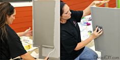 two women are working on the back of a wall with some paint and one woman is pointing at it