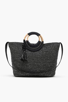 Switch up your after dark style with The Midnight Lurex Wicker Handle Tote. This up-cycled cotton tote bag is handwoven with handmade cane handles. It is lined with an internal pocket and has a subtle mix of silver lurex with natural cotton fabric. The bag is finished with black yarn and silver Zari mix pom pom tassels.Go on, play with this contemporary chic alternative to your evening clutch. Style with your fancy evening ensembles for a dinner to an after party. Up-Cycled Cotton Tote Bag Handw Cane Handles, Leopard Bag, Dark Style, Contemporary Chic, Fabric Black, The Midnight, After Party, Cotton Tote Bag, Evening Clutch