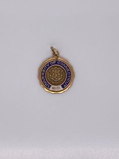 Vintage 14k yellow gold University of Connecticut charm. The charm weighs 3.72 grams of gold. Vintage Yellow Gold Plated Charm, Victorian Yellow Gold Vintage Charm, University Of Connecticut, Connecticut, Pocket Watch, Class Ring, Charm Necklace, University, Charms