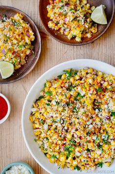 corn salad with limes and seasoning in bowls