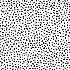 a black and white animal print pattern that looks like it has spots on the surface