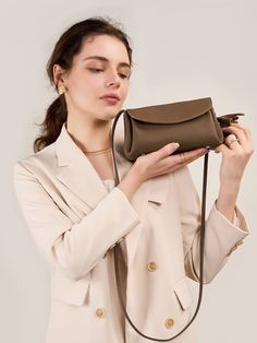 Gender: Women Type: Clutches Features: Adjustable Strap. Inner Pockets Main Materials: Cowhide Lining: Polyester Type of Closure: Magnetic Snap. Zipper Style: Casual. Daily. Stylish Size: Length: 21 cm / 8.27 " Width: 7 cm / 2.76 " Height: 12 cm / 4.72 "