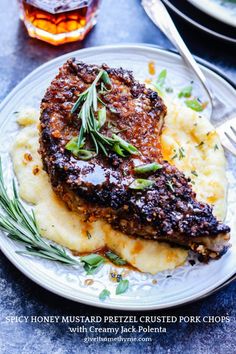 a plate topped with meat and mashed potatoes