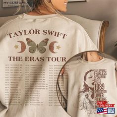 taylor swift the eras tour t - shirt on display in front of a wall with an american flag