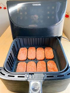 hamburger patties being cooked in an air fryer