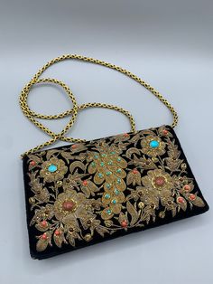 Super Gorgeous velvet clutch or evening bag Handmade from India. Every detail of this bag is kind of art. The bag has incredible quality. Gold bullion braid embroidery surrounding semi precious stones- garnets, turquoise and others. Good vintage condition, velvet at horns is worn out but not much. The size is: 13 cm* 20 cm without chain. Traditional Pouch Shoulder Bag For Evening, Traditional Evening Pouch Shoulder Bag, Rectangular Gold Embroidery Evening Bags, Elegant Embroidered Ceremonial Bags, Traditional Rectangular Evening Bag With Gold Embroidery, Traditional Formal Clutch Shoulder Bag, Traditional Evening Clutch Bag, Elegant Rectangular Ceremonial Bag, Elegant Rectangular Ceremonial Bags