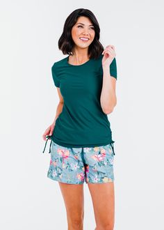 Adele Swim Top Fit & Sizing Tight Fit Sleeve Length 15.8cm (Size S) Top Length 66.5cm (Size S) If you are between sizes, or in doubt, please size up. Features Short Sleeve Round Neckline Does not feature a Built-in Bra Side ruching creates a flattering cinched look UPF 50+ Sun Protection Quick Dry Care Rinse in cold water to wash off any chemicals, chlorinated water or saltwater Machine wash in cold water on gentle cycle Lay flat to dry in the shade Material 82% Nylon Swim Dress Modest, Swim Capris, Swim Skort, Modest Swim, Swim Leggings, Swim Bra, Maternity Swim, Surfing Swimwear, Swim Shirt