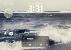 an image of the ocean with waves coming in to shore and clock displayed on screen