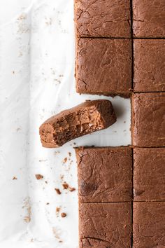 chocolate brownies cut into squares on a white surface