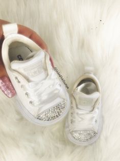 Bling Swarovski Baby Converse Customized With Swarovski Diamond Crystals These are one of a kind beautiful custom made sneakers, embellished with authentic Swarovski Diamond elements, The most expensive Swarovski® crystals in the world, imported from Austria. Shoes are purchased from an authorize Nike retailer new in the box with tags. Hand customized by a certified Swarovski® artist. Shoes arrive beautifully packaged in original box. You will receive a one of a kind item made just for you, The Luxury White Custom Sneakers With Rhinestones, White Custom Sneakers With Rhinestones And Round Toe, Luxury Bedazzled White Sneakers, Shoes Gift Ideas, Converse Customized, Artist Shoes, Swarovski Nike, Red Chucks, Wedding Converse