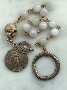 Wonderful wire-wrapped Penal Rosary. Bronze Reproductions of antique medals 20 gauge bronze wire, 8mm moonstone gemstones Ox bone skull