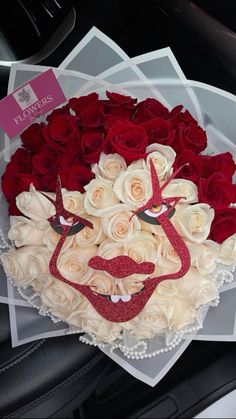 a bouquet of roses in the shape of a man's face