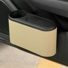 an electronic device is sitting in the back seat of a car with its lid open