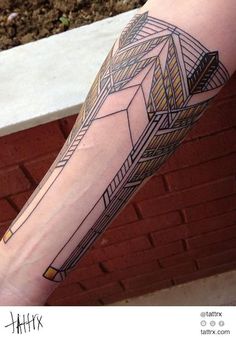 a person with a tattoo on their arm that has an arrow in the middle of it