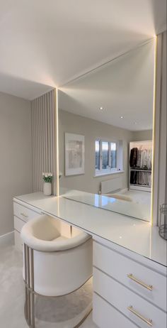 a large mirror sitting on top of a white counter