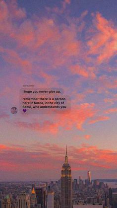 the sky is pink and blue with clouds above it, as well as a quote