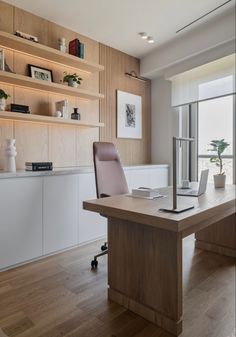 a wooden desk with a laptop on it