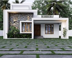 a small white house sitting on top of a lush green field