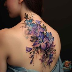 the back of a woman's shoulder with purple flowers on her upper and lower part