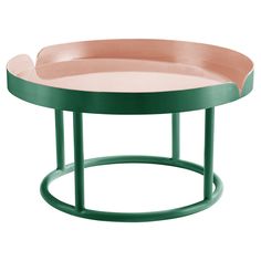 a green and pink coffee table on a white background with an oval shaped tray in the middle