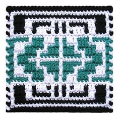 a crocheted square with black, white and green squares in the shape of an inter