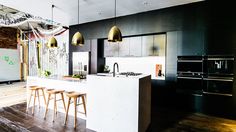 an image of a kitchen setting with white cabinets and countertop space in the middle