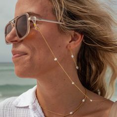 LAST CHANCE - THIS ITEM WILL NOT BE RESTOCKEDWear on your sunglasses or AirPods to keep them safe and stylish! 18K Gold-Plated Stainless Steel Fresh Water Pearls Nickel-Free Lead-Free Hypoallergenic Lobster Clasp 29.5" Chain Adjustable Sunglass Chain Loop Water Resistant White Adjustable Glasses Chain, Everyday Glass Jewelry For Summer, Elegant White Glasses Chains For The Beach, Modern Glass Jewelry For Summer, Summer Glass Chain Jewelry, Elegant Summer Glass Necklaces, Trendy Clear Jewelry With Adjustable Chain, Elegant Glass Glasses Chains For Beach, Gold Glasses Chains For Summer Beach