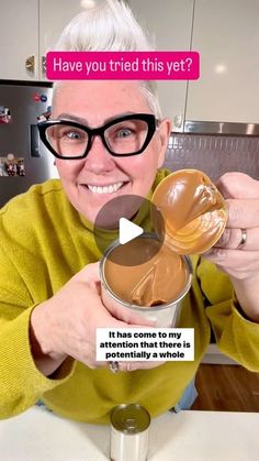 an older woman holding up a bowl of chocolate in her hands with the caption have you tried this yet?