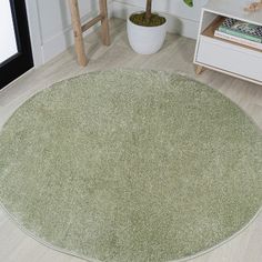 a round rug in the corner of a room