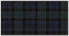 a black and blue plaid fabric with green accents on the bottom, in an irregular pattern