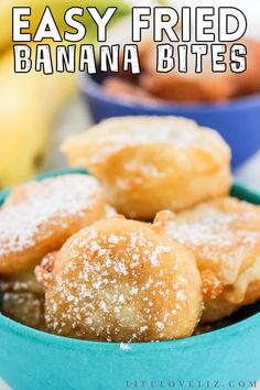 easy fried banana bites in a blue bowl with powdered sugar on top and bananas in the background