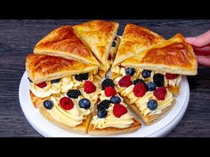 someone is holding a plate with some food on it and there are several slices cut out of the cake