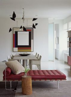 a magazine cover with an image of a red couch and table in front of it