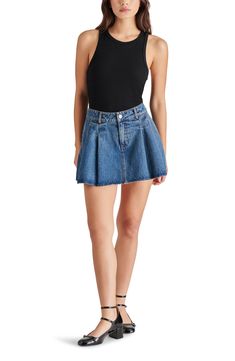 Give the comfort of your favorite shorts and the look of a swingy miniskirt in this stretch-hinted denim skort that's a staple for the sunnier seasons. 24 1/2" leg opening (size Small) Zip fly with button closure 95% cotton, 4% polyester, 1% spandex Machine wash, tumble dry Imported Denim Skort With Built-in Shorts For Summer, Denim Skort With Built-in Shorts For Spring, Spring Denim Skort With Built-in Shorts, Summer Denim Skirt For Day Out, Short Length, Summer Denim Skirt For Day Out, Short Denim Skirt For Summer Day Out, Summer Short Skort In Medium Wash, Summer High Rise Medium Wash Skort, Spring Denim Cutoff Skort