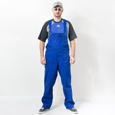 "Working overalls in blue - elastic waist - adjustable and elastic suspenders - 5 pockets - material: no label SIZE size from label: no label best fits men: L/XL MEASUREMENTS chest: free waist: 38-45 inches (96-114 cm) hips: 49 inches (124 cm) inseam: 33 inches (84 cm) The model is 6'1\" (186 cm), measures 41-35-39 (104-88-100 cm) CONDITION - 9/10 - The jumpsuit in great pre-owned condition. Washed, ready to wear." Outdoor Bib Front Overalls With Pockets, Cotton Bib Front Overalls For Outdoor, Blue Cotton Utility Shortalls, Blue Overalls With Pockets, Blue Utility Bib Front Overalls, Blue Utility Overalls With Bib Front, Blue Overalls With Pockets For Streetwear, Blue Utility Overalls For Streetwear, Mechanic Overalls