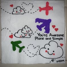 a white towel with embroidered designs on it that says, you're awesome plane and simple