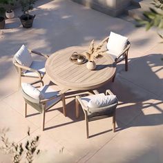 an outdoor table and chairs on a patio